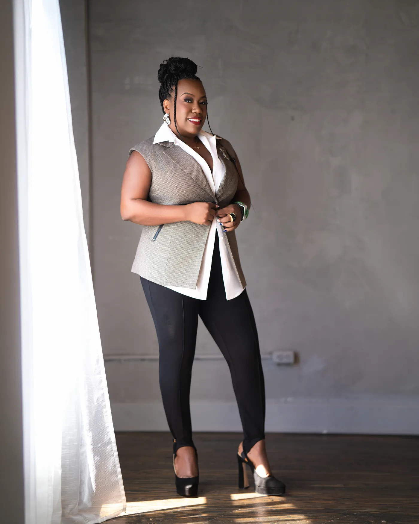 Raevonne Denise by a window